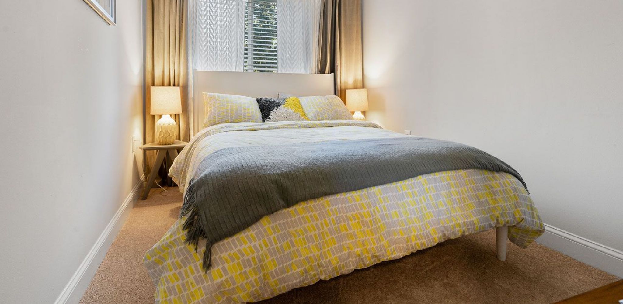 Hawthorne at Bear Creek beautiful apartment bedroom furnished with large bed and end tables