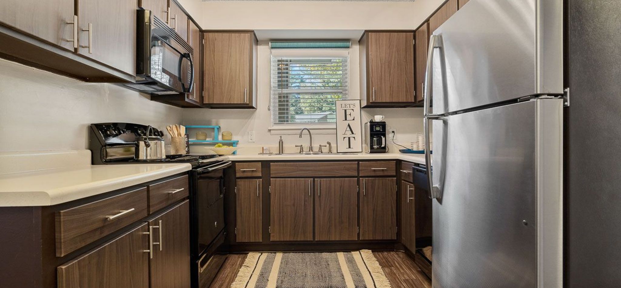 Hawthorne at Bear Creek apartment kitchen with ample cabinet storage