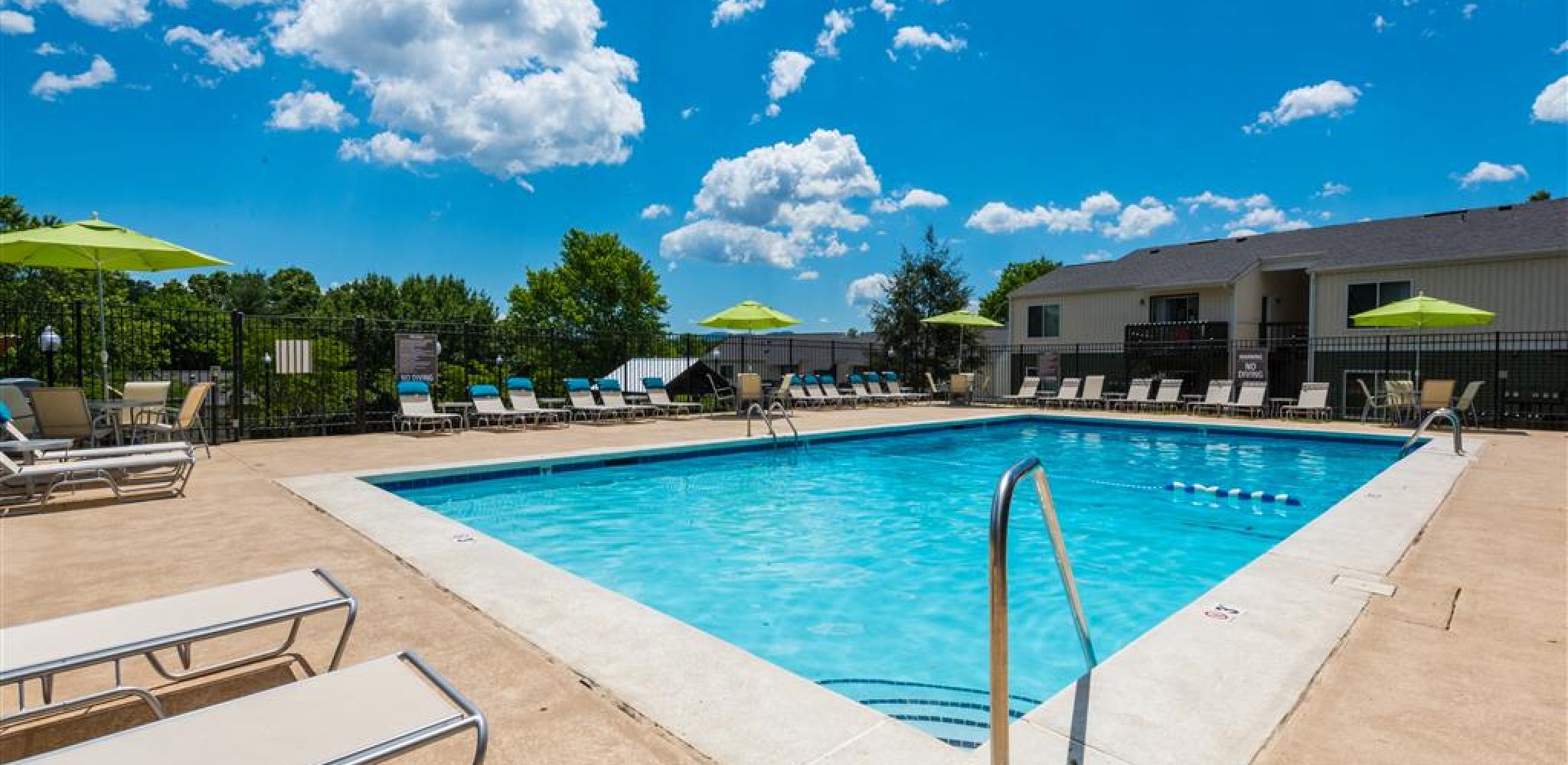 Hawthorne at Bear Creek outdoor pool with surrounding lounge seats