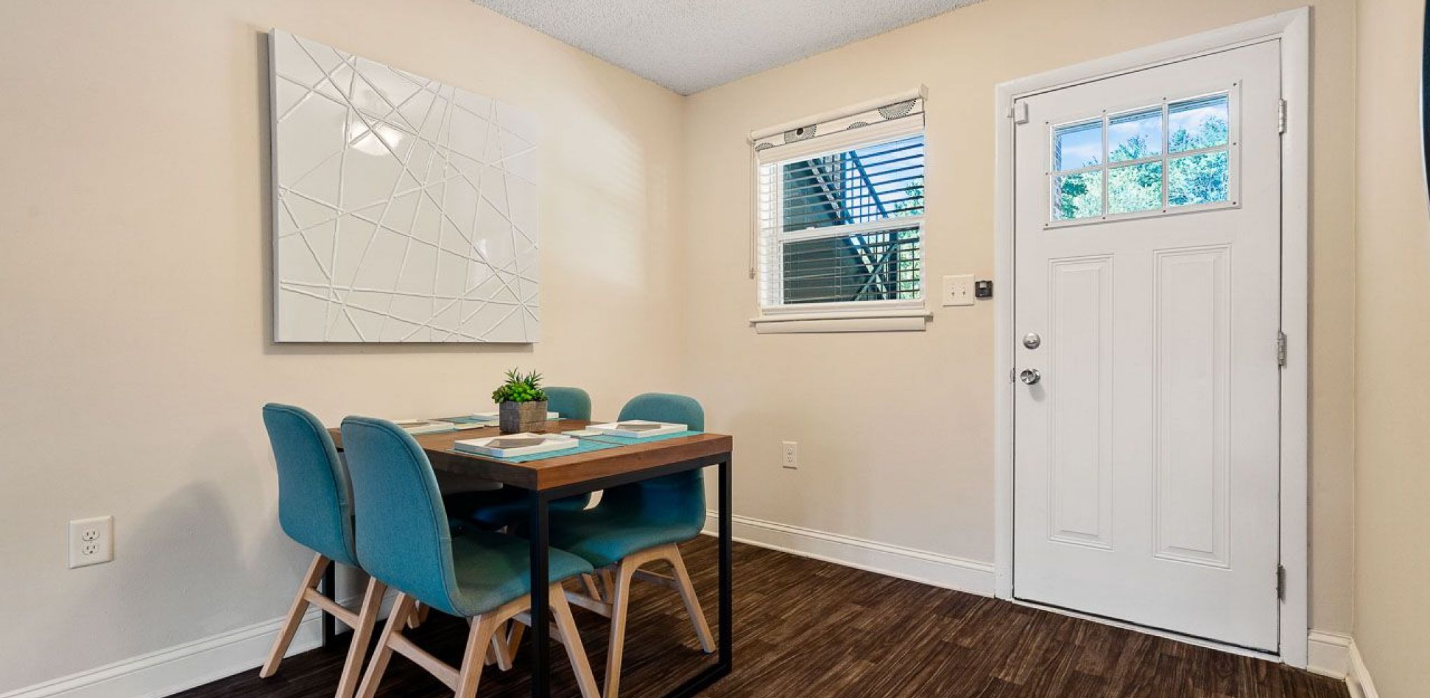 Hawthorne at Bear Creek apartment living area with dining table and chairs